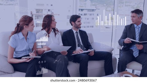 Image of data processing against diverse businesspeople discussing together at office. Computer interface and business data technology concept