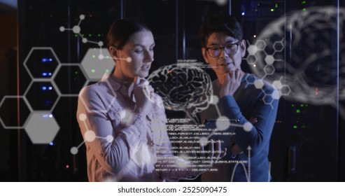 Image of data processing with brains over diverse colleagues using tablet in server room. Global science, technology, computing and digital interface concept digitally generated image.