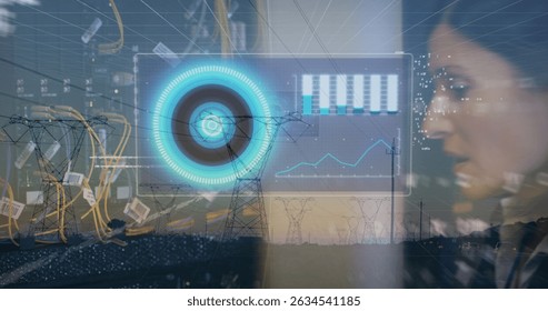 Image of data processing and caucasian woman checking servers over electricity poles at sunset. Electricity, power, digital safety and technology concept digitally generated image.