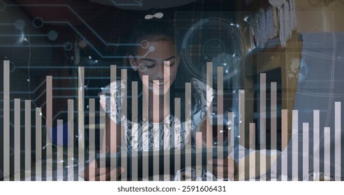 Image of data processing and circuit board over biracial girl using tablet. Global connections, computing and data processing concept digitally generated image.