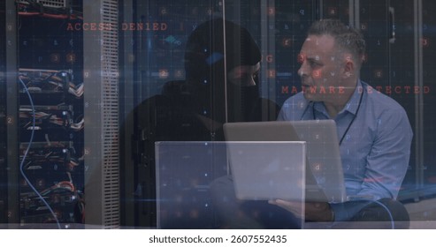 Image of data processing with cyber attack warning over technician and hacker. global internet security, cyber crime, data processing and technology concept digitally generated image.
