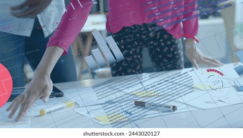 Image of data processing and diagrams over diverse colleagues with blueprints in office. Global business, architecture and digital interface concept digitally generated image.