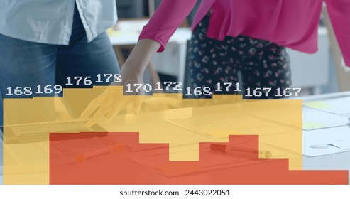 Image of data processing and diagrams over diverse colleagues with blueprints in office. Global business, architecture and digital interface concept digitally generated image.