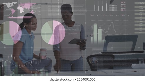 Image of data processing and diagrams over diverse female colleagues talking in office. Business, technology and digital interface concept digitally generated image.