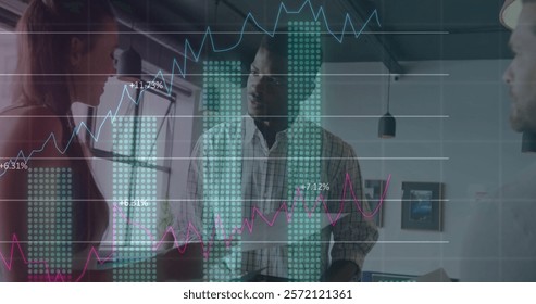 Image of data processing and diagrams over diverse colleagues discussing work in office. Global business and digital interface concept digitally generated image.