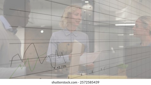 Image of data processing and diagrams over diverse colleagues discussing work. Global business, teamwork and digital interface concept digitally generated image.