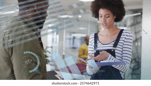 Image of data processing and diagrams over diverse colleagues talking in office. Global business and digital interface concept digitally generated image.