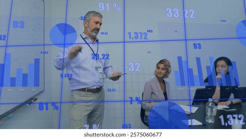Image of data processing and diagrams over diverse colleagues talking in office. Business, technology and digital interface concept digitally generated image.