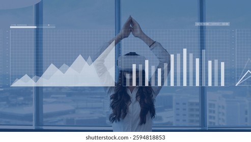 Image of data processing and diagrams over caucasian woman using vr headset. Global business, technology and digital interface concept digitally generated image.