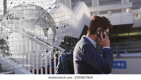 Image of data processing and globe over asian businessman talking on smartphone. Technology and digital interface concept digitally generated image.