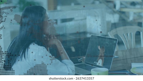 Image of data processing and globe over businesswoman using laptop. Global business, computing and digital interface concept digitally generated image.