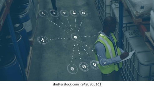 Image of data processing with icons over african american man working in warehouse. Global shipping, networks, digital interface, computing and data processing concept digitally generated image.