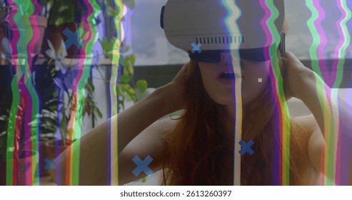 Image of data processing and interference over woman wearing vr headset. global data processing, computing and digital interface concept digitally generated image.