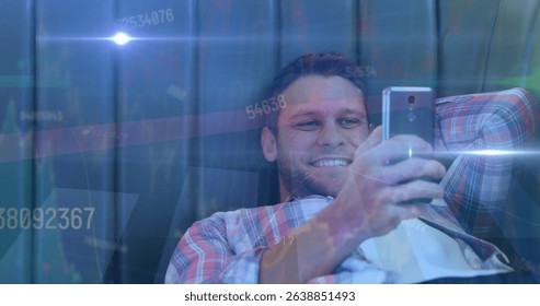 Image of data processing and light trails over caucasian man using smartphone. Global technology, computing and digital interface concept digitally generated image.