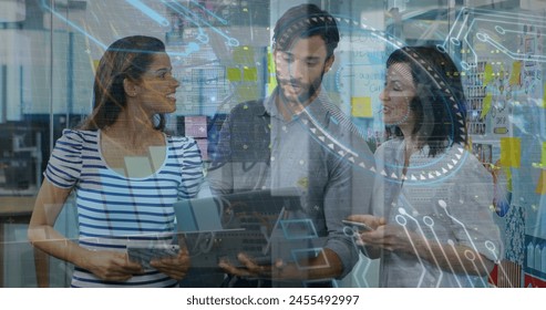 Image of data processing on digital screen over caucasian female and male coworkers. Business, data processing, security, connections and technology concept digitally generated image.