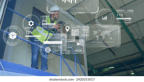 Image of data processing on screens over caucasian man working in warehouse. Global shipping, networks, digital interface, computing and data processing concept digitally generated image.