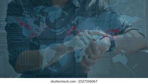 Image of data processing on screens over caucasian man checking smartwatch. Lifestyle, data processing, communication and technology concept digitally generated image.