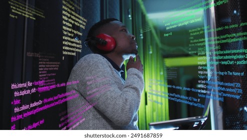 Image of data processing on thoughtful african american male engineer with laptop at server room. Computer interface and business data storage technology concept