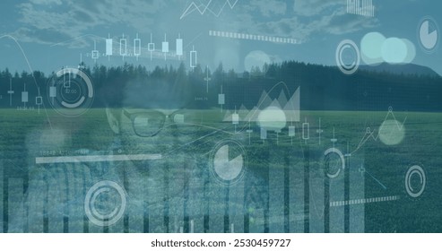 Image of data processing over aerial view of grassland against tired caucasian man at office. Business data technology concept - Powered by Shutterstock