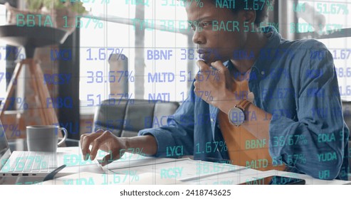 Image of data processing over african american businessman in office. Global finance, business, connections, computing and data processing concept digitally generated image.