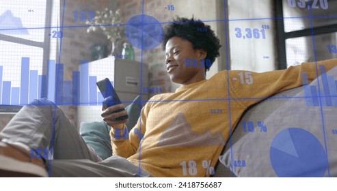 Image of data processing over african american businessman in office. Global finance, business, connections, computing and data processing concept digitally generated image.
