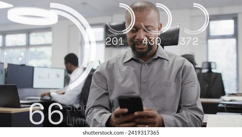 Image of data processing over african american businessman using smartphone in office. Global networks, business, finances, computing and data processing concept digitally generated image.