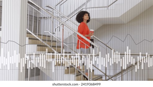 Image of data processing over african american businesswoman in office. Global networks, business, finances, computing and data processing concept digitally generated image.