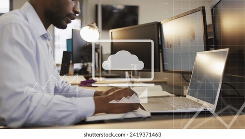 Image of data processing over african american businessman using computer in office. Global networks, business, finances, computing and data processing concept digitally generated image.