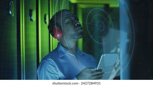 Image of data processing over african american male it engineer and computer servers. Global computing and data processing concept digitally generated image.