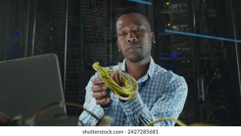 Image of data processing over african american male it engineer and computer servers. Global computing and data processing concept digitally generated image.