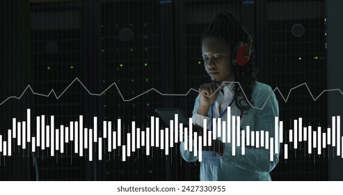 Image of data processing over african american female it engineer and computer servers. Global computing and data processing concept digitally generated image