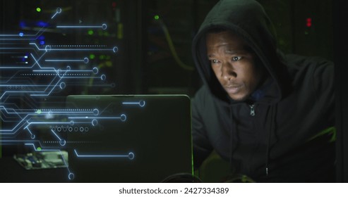 Image of data processing over african american male hacker with computer and computer servers. Global online virus, computing and data processing concept digitally generated image.