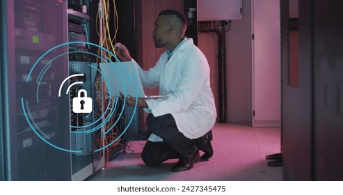 Image of data processing over african american male it engineer and computer servers. Global computing and data processing concept digitally generated image.