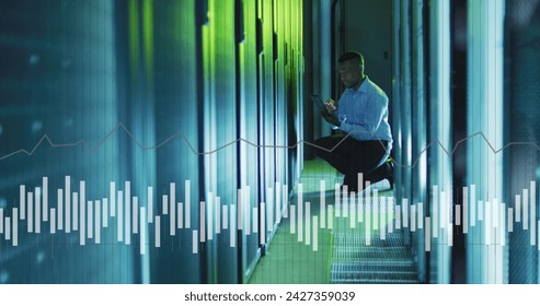 Image of data processing over african american male it engineer and computer servers. Global computing and data processing concept digitally generated image. - Powered by Shutterstock - Get 15% off with code: PIKWIZARD15