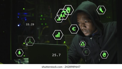 Image of data processing over african american male hacker with computer and computer servers. Global online virus, computing and data processing concept digitally generated image.