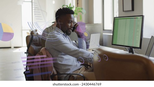 Image of data processing over african american businessman in office. Global business, finances, computing and data processing concept digitally generated image.