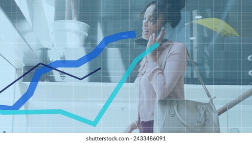 Image of data processing over african american businesswoman using smartphone. Global business and digital interface concept digitally generated image.