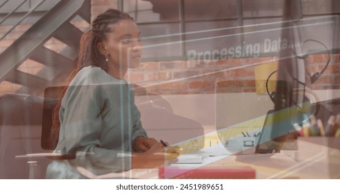 Image of data processing over african american businesswoman. Global business and digital interface concept digitally generated image.