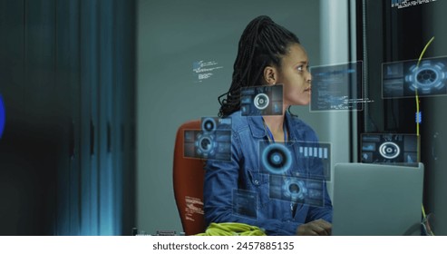 Image of data processing over african american businesswoman by computer servers. Global computing, digital interface and data processing concept digitally generated image.