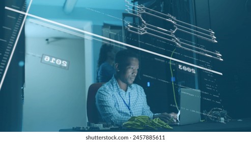 Image of data processing over african american male it technician working by computer servers. Global business, finances, computing and data processing concept digitally generated image.