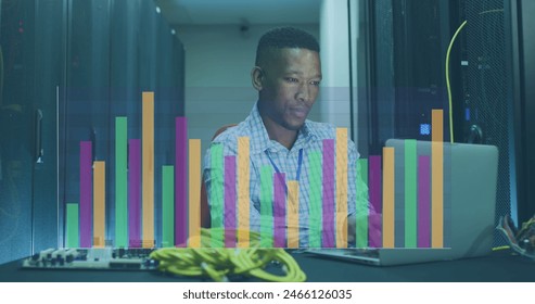 Image of data processing over african american male worker in server room. Global business and digital interface concept, digitally generated image.