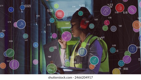 Image of data processing over african american female it engineer by computer servers. Global business, computing, data processing and connections concept digitally generated image.