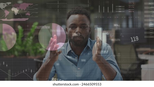 Image of data processing over african american man talking looking at the camera at office. Computer interface and business data technology concept