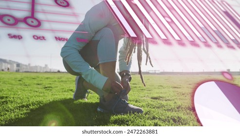 Image of data processing over african american man tying shoe lace by field. Global sport, fitness, digital interface and data processing concept digitally generated image.
