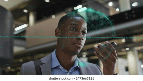 Image of data processing over african american businessman talking on smartphone. Global business, finances and digital interface concept digitally generated image.