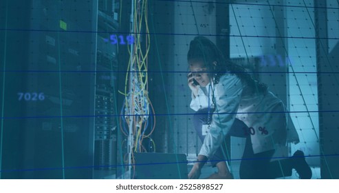 Image of data processing over african american it woman by computer servers. Global computing, digital interface and data processing concept digitally generated image.