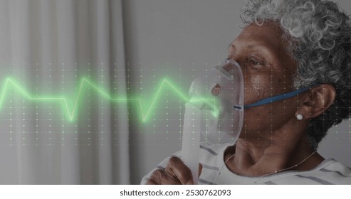 Image of data processing over african american senior female patient with oxygen mask. Global medicine, connections, computing and data processing concept digitally generated image. - Powered by Shutterstock