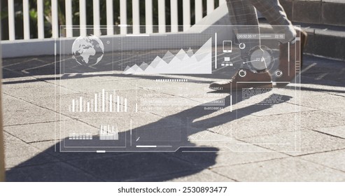 Image of data processing over african american businessman walking down the stairs. Global business, computing and digital interface concept digitally generated image. - Powered by Shutterstock