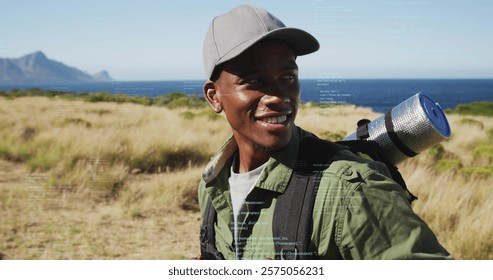 Image of data processing over african american man hiking. Global technology, lifestyle, computing and digital interface concept digitally generated image.