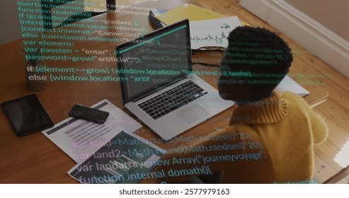 Image of data processing over african american woman using laptop working from home. Network, data, digital interface, business, remote working and communication, digitally generated image.